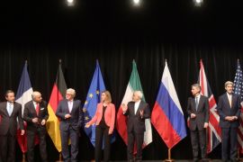Chinese Foreign Minister Wang Yi, French Foreign Minister Laurent Fabius, German Foreign Minister Frank-Walter Steinmeier, European Union High Representative Federica Mogherini, Iranian Foreign Minister Mohammad Javad Zarif, British Foreign Secretary Philip Hammond and U.S. Secretary of State John Kerry, from left, pose for a group photo following talks with Iran on their nuclear program in Vienna, Austria, Tuesday, July 14, 2015. (AP Photo/Ronald Zak)