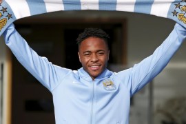 New Manchester City signing Raheem Sterling poses with a club scarf as he leaves the club's Etihad Stadium in Manchester, Britain, July 14, 2015. Manchester City made Raheem Sterling the most expensive English player in history when they completed a deal for the 20-year-old forward on Tuesday, rubber-stamping an acrimonious end to his Liverpool career. City paid 49 million pounds for Sterling, according to media reports, with the England international signing a five-year contract at the Etihad Stadium. REUTERS/Andrew Yates