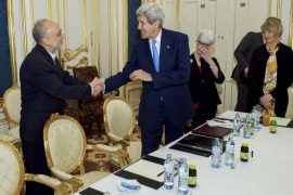U.S. Secretary of State John Kerry (2ndL) shakes hands with Dr. Ali Akbar Salehi (L), the vice president of Iran for atomic energy and president of the Atomic Energy Organization of Iran, at a hotel in Vienna, Austria June 30, 2015. Kerry and his Iranian counterpart, Javad Zarif, held a "productive" meeting in Vienna on Tuesday, the State Department said, as negotiations on curbing Iran's nuclear program were extended. REUTERS/State Department/Handout FOR EDITORIAL USE ONLY. NOT FOR SALE FOR MARKETING OR ADVERTISING CAMPAIGNS. THIS IMAGE HAS BEEN SUPPLIED BY A THIRD PARTY. IT IS DISTRIBUTED, EXACTLY AS RECEIVED BY REUTERS, AS A SERVICE TO CLIENTS