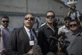 Canadian-Egyptian Al-Jazeera journalist Mohamed Fahmy (C-L) and his Egyptian colleague Baher Mahmoud (C-R) speak to reporters outside the Tora prison in Cairo, Egypt, 30 July 2015. The verdict in the retrial of the Al-Jazeera journalists has been postponed until the beginning of August.