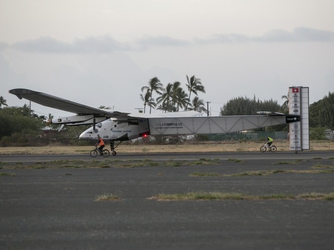 The Solar Impulse 2, a solar-powered airplane, lands at the Kalaeloa Airport, Friday, July 3, 2015 in Kapolei, HI. The plane, piloted by Andre Borschberg, is attempting to fly around the world without fuel. (AP Photo/Marco Garcia)