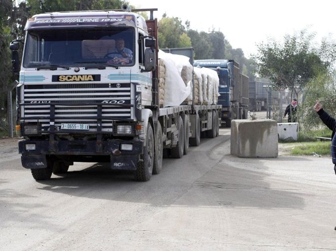 GAZA - NOVEMBER 25: Trucks carrying construction materials cross into the Gaza Strip at the Karam Abu Salem (Kerem Shalom) border crossing into the southern Gaza Strip on November 25, 2014.