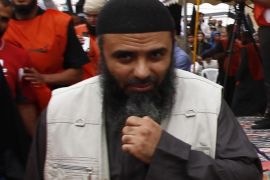 Saifallah Benahssine, better known as Abu Iyadh, the de facto leader of Tunisia's Salafi Islamists, attends a rally in the central town of Kairouan in this May 20, 2012 file picture. Tunisian state media said the head of the country's Islamist militants had been captured in Libya by U.S. and Libyan forces on December 30, 2013, though his organisation denied he had been detained. The U.S. army also said it had not played any part in any move against Ansar al Sharia leader Abu Iyadh - the man accused of inciting an attack on the U.S. embassy in Tunisia in 2012. REUTERS/Anis Mili/Files (TUNISIA - Tags: POLITICS CIVIL UNREST CRIME LAW)