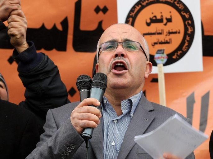 Ridha Belhaj, a spokesman of the Islamist Hizb Ut-Tahrir party, speaks to supporters during a protest against the new Constitution they call 'Constitution of the laity', in Tunis, Tunisia, 24 January 2014. Tunisian lawmakers on 19 January had postponed a debate on the last chapter in a long-awaited new draft constitution, to give themselves more time to reach agreement on outstanding issues. The National Constituent Assembly had been due to debate the last articles in the draft charter in a plenary session. The ratification of the constitution will mark a major step in Tunisia's transition to democracy, which began three years ago with the overthrow of dictator Zine Abidine Ben Ali.