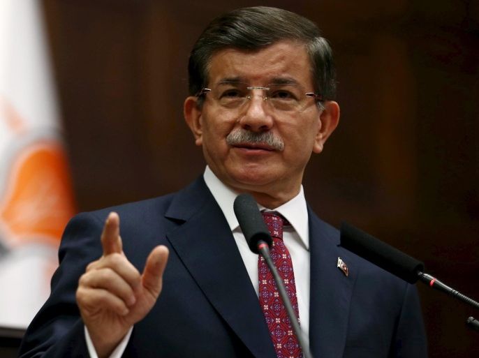 Turkey's Prime Minister Ahmet Davutoglu addresses members of parliament from his ruling AK Party (AKP) during a meeting at the Turkish parliament in Ankara, Turkey, July 9, 2015. Ahmet Davutoglu said he expected to receive a mandate on Thursday to form a new government and to start coalition talks next week, more than a month after an election deprived his AK Party of a parliamentary majority. Opposition lawmakers have accused President Tayyip Erdogan, a founder of the AKP and Turkey's most popular - and polarizing - political figure, of deliberately delaying coalition talks in order to keep a firm grip on power and push for a snap election he hopes would give his party a majority. REUTERS/Stringer