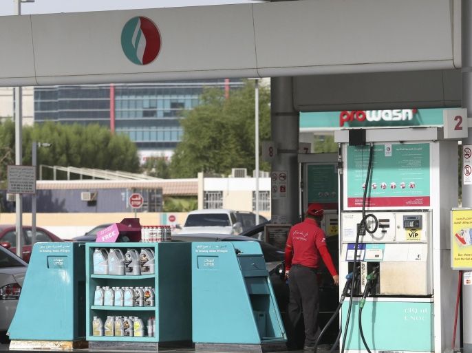 A station attendant stands by a fuel pump on the forecourt of an Emirates National Oil Co. (ENOC) gas station in Dubai, United Arab Emirates, on Saturday, Nov. 8, 2014. The United Arab Emirates' central bank limited mortgage lending and required larger down payments, and the Land Department doubled transaction taxes early last year as policymakers tried to avoid a repeat of a property bubble in 2008 that caused values to slump by about 65 percent.