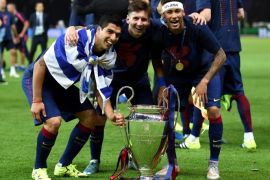 BERLIN, GERMANY - JUNE 06: (L-R) Luis Suarez, Lionel Messi and Neymar of Barcelona celebrate with the trophy after the UEFA Champions League Final between Juventus and FC Barcelona at Olympiastadion on June 6, 2015 in Berlin, Germany.