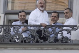 (From L) Iranian Deputy Foreign Minister Abbas Araqchi, Iranian Foreign Minister Mohammad Javad Zarif, Iran's deputy foreign minister for European and American Affairs, Majid Takht-Ravanchi, and Hossein Fereydoun, the brother of the Iranian president gather onto a balcony of the Palais Coburg Hotel, where the Iran nuclear talks meetings are being held in Vienna on July 11, 2015. World powers struggled on July 11 to break a deadlock in marathon negotiations with Iran, as they seek a deal curbing Tehran's nuclear ambitions in return for sanctions relief. AFP PHOTO / JOE KLAMAR