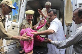 An Indian civilian woman injured in exchange of fire by troops on the India Pakistan border is brought for treatment at the government medical college hospital in Jammu, India, Wednesday, July 15, 2015. Indian and Pakistani troops exchanged fire in the disputed Himalayan region of Kashmir on Wednesday, killing a woman and wounding at least four other people on the Indian side, officials said. (AP Photo/Channi Anand)