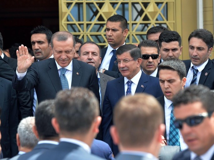 Turkish President Recep Tayyip Erdogan salutes after he inaugurated a mosque on the grounds of his gigantic palace complex and opens it to the public in an apparent effort to stave off more criticism over his spending, in the Bestepe district of Ankara, Turkey, Friday, July 3, 2015. Erdogan, who has been accused of squandering state resources by building the grandiose 1,150-room presidential palace, dedicated the mosque to the people at the opening ceremony, naming it the "Bestepe People's Mosque." (AP Photo)