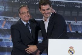 Goalkeeper Iker Casillas, right, smiles as he embraces Real Madrid’s President Florentino Perez before a press conference at the Santiago Bernabeu stadium in Madrid, Spain, Monday July 13, 2015. Casillas appeared with the club’s president a day after he gave an emotional press conference alone putting an end to his 25 years as a Real Madrid goalkeeper. Casillas will now play for FC. Porto. (AP Photo/Paul White)