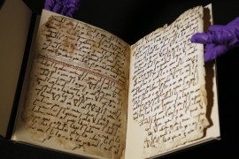 A university assistant shows fragments of an old Quran at the University in Birmingham, in Birmingham central England Wednesday, July 22, 2015. The University of Birmingham said Wednesday that scientific tests prove a Quran manuscript in its collection is one of the oldest known and may have been written close to the time of the Prophet Muhammad. Radiocarbon testing at Oxford University dated the parchment to the time of the prophet, who is generally believed to have lived between 570 and 632.(AP Photo/Frank Augstein)