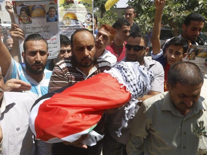 Palestinians carry the body of 18-month-old Ali Dawabsha during his funeral at the West Bank village of Douma near Nablus City, 31 July 2015. A Palestinian infant was killed and several people injured when their home was set alight in the northern West Bank early 31 July 2015, an official said. A group of masked people believed to be Israeli settlers threw flammable bombs into two houses on the outskirts of the village of Douma, south of Nablus, said Ghassan Daghlas, a Palestinian Authority official.