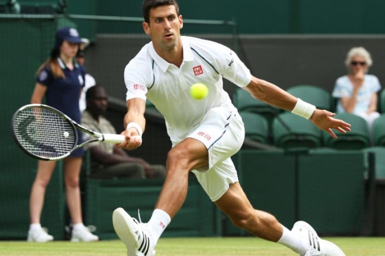 Novak Djokovic of Serbia returns to Bernard Tomic of Australia in their third round match during the Wimbledon Championships at the All England Lawn Tennis Club, in London, Britain, 03 July 2015.