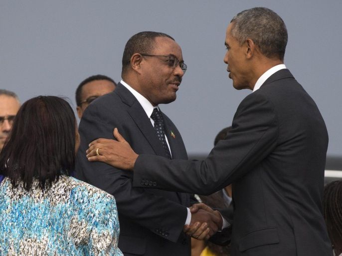 President Barack Obama, right, shakes hands with Ethiopian Prime Minister Hailemariam Desalegna after arriving at Addis Ababa Bole International Airport, on Sunday, July 26, 2015, in Addis Ababa. Obama is the first sitting U.S. president to visit Ethiopia. (AP Photo/Evan Vucci)