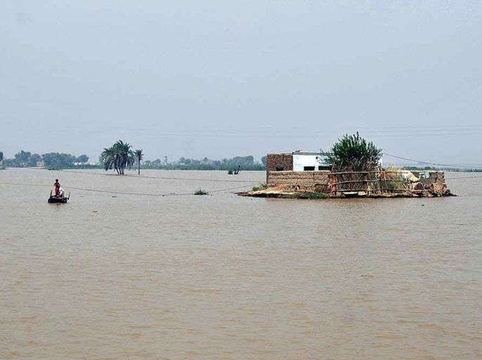 PUNJAP, PAKISTAN - JULY 22: Pakistani flood victims are evacuated from the flooded area in Layyah, Punjab province, Pakistan, on July 22, 2015. Rescuers in northern Pakistan were rushing on 21 July to reach thousands of villagers stranded after floods killed 14 people and swept sway bridges and roads, officials said. The National Disaster Management Authority issued a warning of high floods in the Indus River and heavy rains which could inundate several low-lying areas in the northeastern Punjab and southern Sindh provinces in the next couple of days.