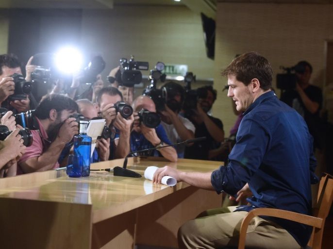 Real Madrid's goalkeeper Iker Casillas poses for photographers prior to a press conference at the Santiago Bernabeu stadium in Madrid on July 12, 2015. Real Madrid's emblematic captain and goalkeeper Iker Casillas is set to leave the club for FC Porto after 25 years during which he won everything in the game with the Spanish giants. AFP PHOTO/ PIERRE-PHILIPPE MARCOU