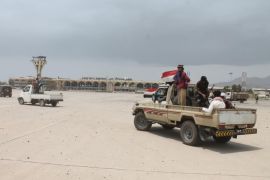 Fighters against Shiite rebels known as Houthis gather in front of the airport in the port city of Aden, Yemen, Thursday, July 16, 2015. Saudi-backed Yemeni troops and fighters have driven Shiite rebels out of two major neighborhoods in the southern port city of Aden, Thursday, prompting street celebrations by residents after weeks of fierce fighting. (AP Photo/Abo Muhammed)