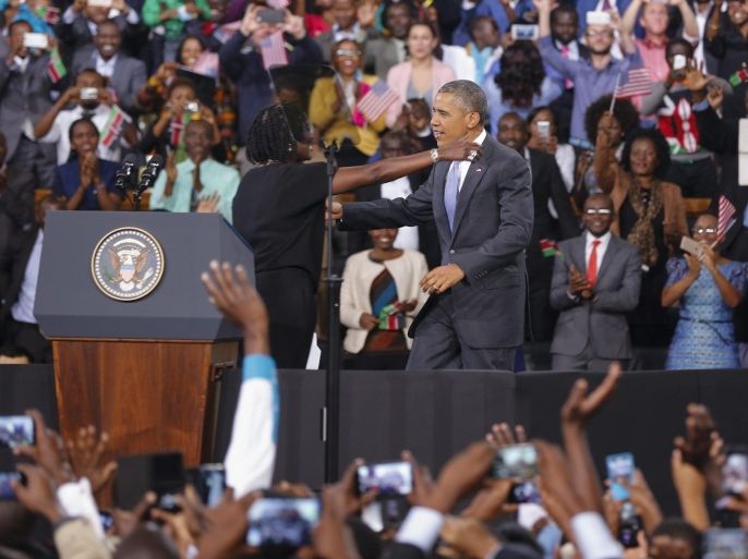 US President Barack Obama (C-R) is hugged by his half-sister Auma Obama (C-L) as he arrives to deliver a speech at Moi International Sports Complex in Nairobi, Kenya, 26 July 2015. Obama is wrapping up his three-day visit to Kenya before heading to Ethiopia. It was his first visit to his father's homeland since becoming president. He promoted Africa as a hub for global economic growth and addressed issues on terrorism, economic recovery and human rights.