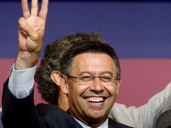Barcelona's President Josep Maria Bartomeu celebrates his victory after being re-elected to lead the triple winners for the next six years after a vote on Saturday, beating former incumbent Joan Laporta, in Barcelona, Spain, late July 18, 2015. REUTERS/Albert Gea