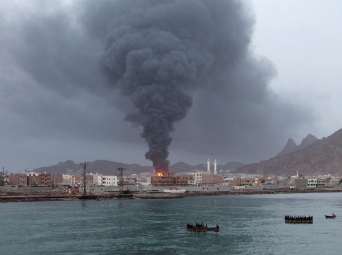 Fire and smoke rises from the Aden oil refinery following a reported shelling attack by Shiite Huthi rebels in the embattled southern Yemeni city of Aden on July 13, 2015. Clashes have intensified in Aden, where rebels have besieged many areas controlled by southern fighters loyal to exiled President Abedrabbo Mansour Hadi and known as the Popular Resistance. AFP PHOTO / SALEH AL-OBEIDI