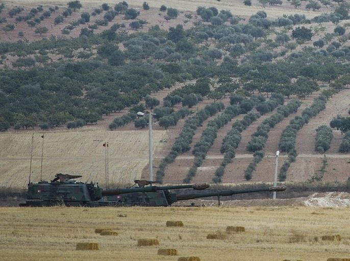 GAZIANTEP, TURKEY - JULY 30: Turkish tanks and howitzers are deployed in Karkamis district of Gaziantep, at Syria borderline for security after the clashes with Turkish soldiers and Daesh terrorists, in Turkey, on July 30, 2015.