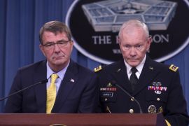 Defense Secretary Ash Carter and Joint Chiefs Chairman Gen, Martin Dempsey listen to a reporters question during a news conference at the Pentagon, Wednesday, July 1, 2015. (AP Photo/Cliff Owen)