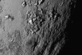 A new close-up image of a region near Pluto�s equator reveals a range of youthful mountains rising as high as 11,000 feet (3,500 meters) above the surface of the icy body, in a picture released by NASA in Laurel, Maryland July 15, 2015. A U.S. spacecraft sailed past the tiny planet Pluto in the distant reaches of the solar system on Tuesday, capping a journey of 3 billion miles (4.88 billion km) that began nine and a half years ago. NASA's New Horizons spacecraft passed by the ice-and-rock planetoid and its entourage of five moons at 7:49 a.m. EDT (1149 GMT). The event culminated an initiative to survey the solar system that the space agency embarked upon more than 50 years ago. REUTERS/NASA New Horizons/Handout via Reuters TPX IMAGES OF THE DAY. THIS IMAGE HAS BEEN SUPPLIED BY A THIRD PARTY. IT IS DISTRIBUTED, EXACTLY AS RECEIVED BY REUTERS, AS A SERVICE TO CLIENTS. FOR EDITORIAL USE ONLY. NOT FOR SALE FOR MARKETING OR ADVERTISING CAMPAIGNS