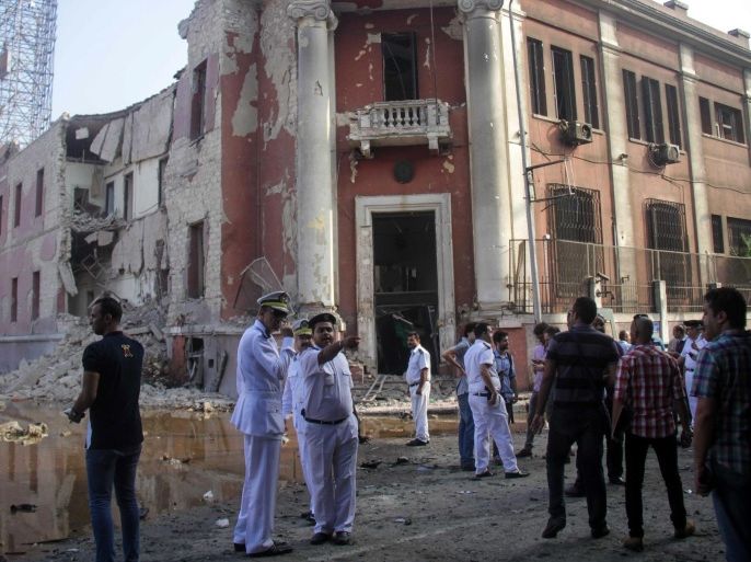Egyptian security officials inspect the site following a bomb blast at the Italian Consulate in Cairo, Egypt, 11 July 2015. An explosion on 11 July outside the Italian Consulate in central Cairo killed at least one person, State-run newspaper al-Ahram quoted a Health Ministry spokesman as saying at least four others were injured. A news correspondent at the scene said an outer wall of the consulate was destroyed and nearby buildings were damaged. The cause of the blast was unclear. There was no immediate claim of responsibility. The Italian consulate complex is located in downtown Cairo and it includes a cultural center as well a social club.