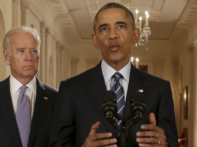 President Barack Obama, standing with Vice President Joe Biden, delivers remarks in the East Room of the White House in Washington, 14 July 2015. After 18 days of intense and often fractious negotiation, diplomats Tuesday declared that world powers and Iran had struck a landmark deal to curb Iran's nuclear program in exchange for billions of dollars in relief from international sanctions. EPA/ANDREW HARNIK / AP / POOL Pool Photo