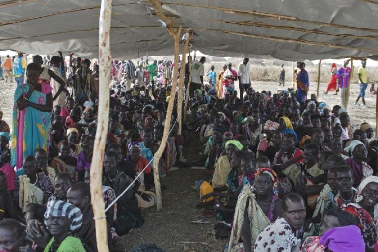 IDP's (Internally displaced persons) wait to receive food rations at the UNMISS Protection of Civilian (POC) site in Bentiu, Unity State, on February 27, 2015. The camp receives up to 200 new IDP each day, due to lack of services in the town. The World Health Organization today appealed for 1.0 billion USD in additional funds to help provide life-saving health services to millions in need in conflict-ravaged Syria, Iraq, Central African Republic and South Sudan. For South Sudan, which has been wracked by fighting since an alleged attempted coup in December 2013, 90 million USD is needed to provide vital health services to some 3.35 million people, WHO said. AFP PHOTO / CHARLES LOMODONG