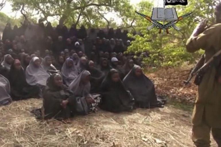 FILE - This Monday, May 12, 2014, file image taken from video by Nigeria's Boko Haram terrorist network, shows the alleged missing girls abducted from the northeastern town of Chibok. On the first anniversary of the kidnapping by Islamic extremists of hundreds of girls from a school in northeast Nigeria, President-elect Muhammadu Buhari said Tuesday, April 14, 2015, that he cannot promise to find the 219 who are still missing. A year after the April 14-15, 2014, mass abduction at a school in Chibok. (AP Photo)