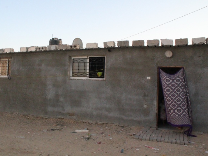 ‪منزل عائلة شمالي الذي اضطرت لبنائه بعد تدميره من قبل الجيش الإسرائيلي‬ (الجزيرة)