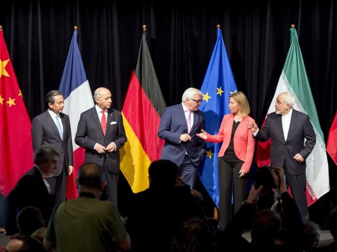 (L-R) China's Foreign Minister Wang Yi, French Foreign Minister Laurent Fabius, German Minister for Foreign Affairs Frank-Walter Steinmeier, High Representative of the European Union for Foreign Affairs and Security Policy Federica Mogherini, Iranian Foreign Minister Mohammad Javad Zarif, British Foreign Secretary Philip Hammond and US Secretary of State John Kerry pose for a picture during the final press conference of Iran nuclear talks in Vienna, Austria on July 14, 2015. AFP PHOTO / JOE KLAMAR