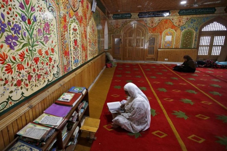 Kashmiri Muslim women read the Koran inside a mosque at the shrine of Sufi Saint Khawaja Naqashband during the holy month of Ramadan in Srinagar June 29, 2015. REUTERS/Danish Ismail