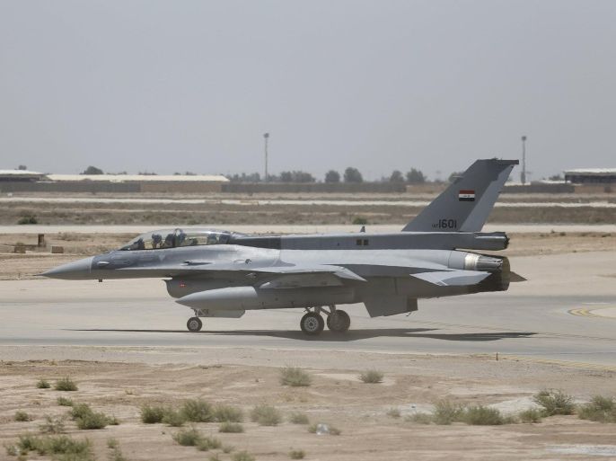 U.S. F-16 fighter jet is seen during an official ceremony to receive four of these aircrafts from the U.S. at the tarmac a military base in Balad, Iraq, July 20, 2015. REUTERS/Thaier Al-Sudani