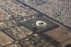 An aerial view taken from a plane approximately 2,000 feet above the ground on August 16, 2015 shows the Jaber Stadium and its surrounding areas which is located 15 kilometers south of Kuwait City. The 400,000 square meters structure has a total capacity of 65,000, making it the 25th largest stadium in the world. The stadium is slated to host the 23rd Gulf Cup tournament matches in December 2015. AFP PHOTO / YASSER EL-ZAYYAT