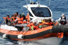 An Italian Coast Guard boat transfers rescued migrants to the Reggio Calabria harbor, Italy, Monday, Aug. 3, 2015. (AP Photo/Adriana Sapone)