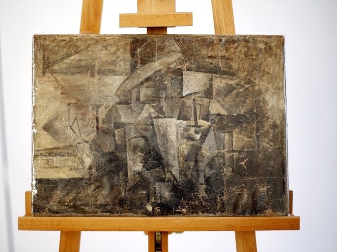 A stolen painting by Pablo Picasso entitled "La Coiffeuse" worth an estimated $15 million sits on an easel at a ceremony where U.S. law enforcement officials repatriated it to the government of France at the French embassy in Washington August 13, 2015. The stolen painting was discovered by U.S. Customs and Border Protection officers when someone shipped it to the U.S. from Belgium, marking it as thought it were a handicraft worth just 30 euros. REUTERS/Jonathan ErnstATTENTION EDITORS - NO ARCHIVES. NO SALES