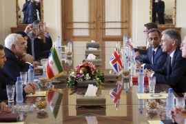 British Foreign Secretary Philip Hammond, second right, and Iranian Foreign Minister Mohammad Javad Zarif, third left, attend a round of talks in Tehran, Iran, Sunday, Aug. 23, 2015. British Foreign Secretary Philip Hammond reopened the British Embassy in Tehran on Sunday, nearly four years after it was closed following an attack by hard-liners. (AP Photo/Vahid Salemi)