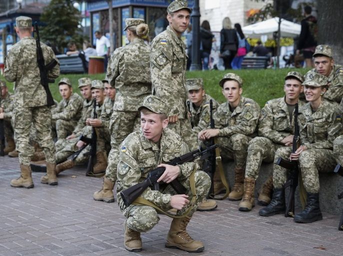 Ukrainian soldiers wait for a rehearsal of the military parade at the Independence Square in downtown Kiev, Ukraine, 20 August 2015. The parade will be held in honour of Independence Day of Ukraine on 24 August.