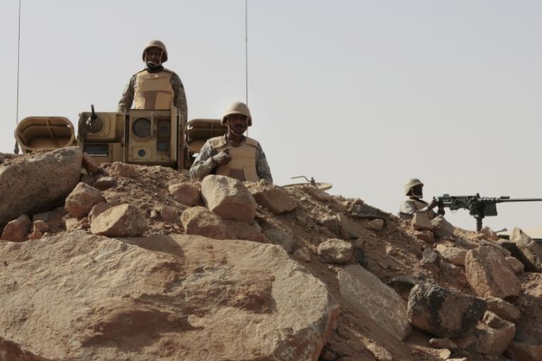 FILE - In this Tuesday, April 21, 2015 file photo, Saudi soldiers stand on top of armor vehicles, on the border with Yemen at a military point in Najran, Saudi Arabia. A Saudi-owned news channel, al-Hadath, aired live footage Monday, May 11, 2015 of tanks and armored personnel carriers loaded onto giant trucks, saying they were part of a "strike force" deploying to the kingdom's border with Yemen. There have been no signs to suggest that a ground offensive was imminent, although the coalition has not ruled one out.(AP Photo/Hasan Jamali, File)