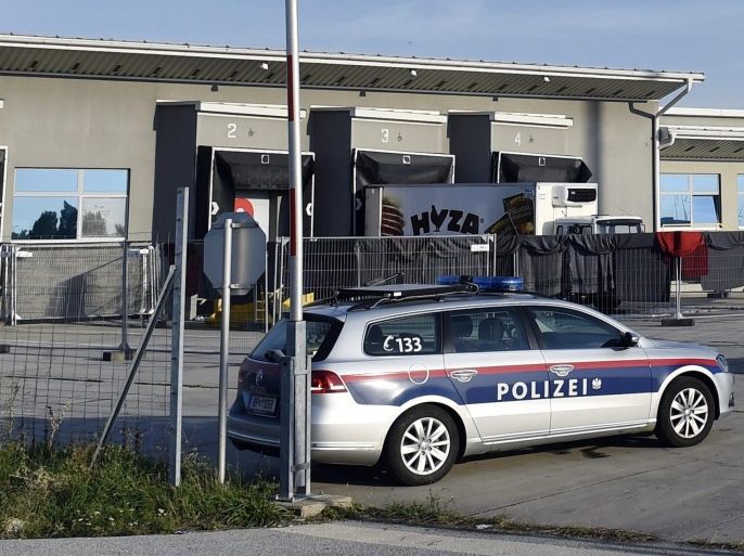A refrigerated truck, in which bodies of 71 migrants have been found on the A 4 Austrian highway, is parked in a facility which used to be a veterinary station at the border in Nickelsdorf, Austria on 28 August 2015. Austrian police said 28 August 2015 that three people were in custody in Hungary over the discovery of 71 dead migrants in an abandoned truck with Hungarian number plates.