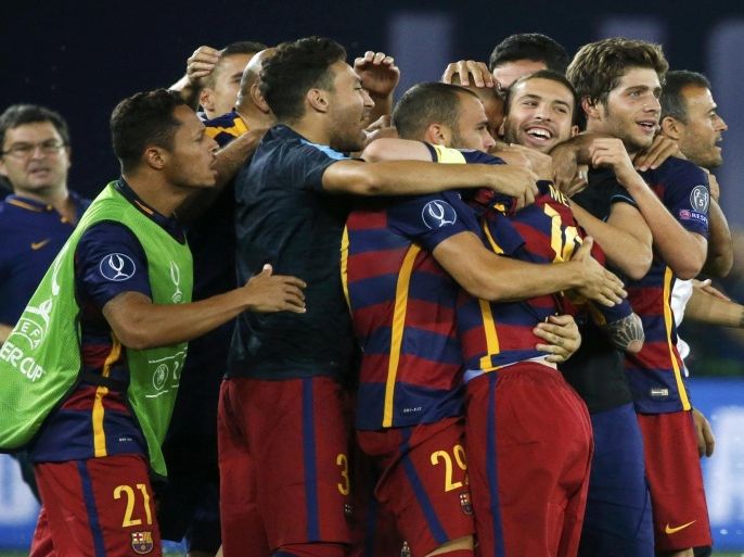 Barcelona's players and coaches celebrate their victory over Sevilla in the UEFA Super Cup soccer match at Boris Paichadze Dinamo Arena in Tbilisi, Georgia, August 12, 2015. REUTERS/Grigory Dukor
