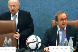 (FILE) A file picture dated 25 July 2015 of FIFA President Joseph Blatter (L) taking a seat next to UEFA President Michel Platini (R) during a seminar ahead of the Preliminary Draw for the FIFA World Cup 2018 in St.Petersburg, Russia. Michel Platini on 29 July 2015 confirmed his intention to run for the FIFA presidency as successor to Joseph Blatter. Platini said in a statement on the UEFA website he has written to the 209 members of FIFA declaring his candidacy and asking for support in his bid to lead the global football governing body.