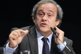 FILE - In this May 28, 2015 file picture, UEFA-President Michel Platini speaks during a news conference after a meeting of the European Soccer federation UEFA in Zurich, Switzerland. Michel Platini has launched his campaign to succeed Sepp Blatter as FIFA president, aiming to give the scandal-hit governing body "the dignity and the position it deserves." Platini, the UEFA president and a FIFA vice president, wrote to member federations in Europe on Wednesday July 29, 2015 saying he will stand in the election and is counting on their support. (Walter Bieri/Keystone via AP,file)