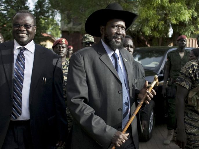 FILE - In this Monday, April 26, 2010 file photo, then Vice President Riek Machar, left, and President of South Sudan Salva Kiir, centre, arrive for a press conference in Juba, South Sudan. A South Sudan spokesman said Tuesday, Aug. 25, 2015 that President Salva Kiir may sign a peace deal with rebels on Wednesday, more than a week after refusing to do so, but added that Kiir will first express "reservations" about the agreement with rebel leader Riek Machar at a summit with regional leaders in the capital, Juba.(AP Photo/Pete Muller, File)