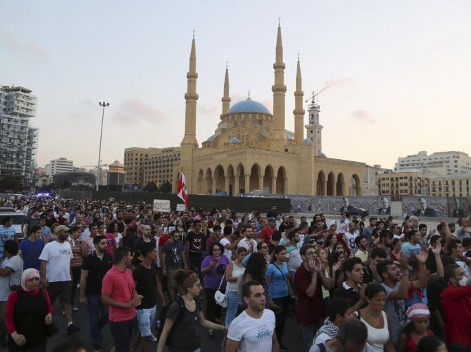 People chant slogans and carry signs as they take part in a march from downtown Beirut towards the American University of Beirut (AUB) hospital, August 26, 2015, to express solidarity with a protester who was injured during clashes with police on Sunday. The powerful Shi'ite party Hezbollah and its Christian allies walked out of an emergency Lebanese cabinet meeting on Tuesday in protest at a proposed solution to a garbage disposal crisis that has ignited violent protests in Beirut. Public anger that has come to a head over the trash crisis turned violent at the weekend, with scores of protesters and security forces injured. REUTERS/Aziz Taher