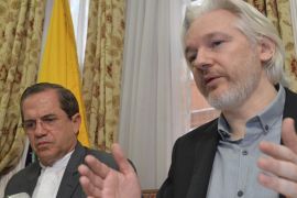 FILE - In this Aug. 18, 2014, file photo, WikiLeaks founder Julian Assange, right, speaks during a news conference with Ecuador's Foreign Minister Ricardo Patino, inside the Ecuadorian Embassy in London. Swedish prosecutors on Thursday Aug. 13, 2015 dropped cases of lesser sexual misconduct against WikiLeaks founder Julian Assange but said they still want to question him on accusations of rape made after his visit to Stockholm five years ago. (John Stillwell/Pool Photo via AP, File)