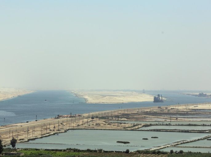 SUEZ, EGYPT - AUGUST 06: A view of two channels of the Suez Canal during the opening ceremony of the new Suez Canal expansion including a new 35km (22 mile) channel on August 6, 2015 in Suez, Egypt. The new channel of the Suez Canal was finished in a year at a cost of 8 billion USD and is designed to increase the speed and capacity of ships. The new branch is being celebrated as a major nationalist project. (Photo by David Degner/Getty Images).